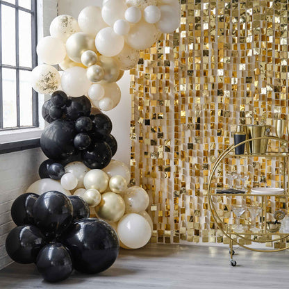 black and gold theme birthday party balloon garland backdrop decoration