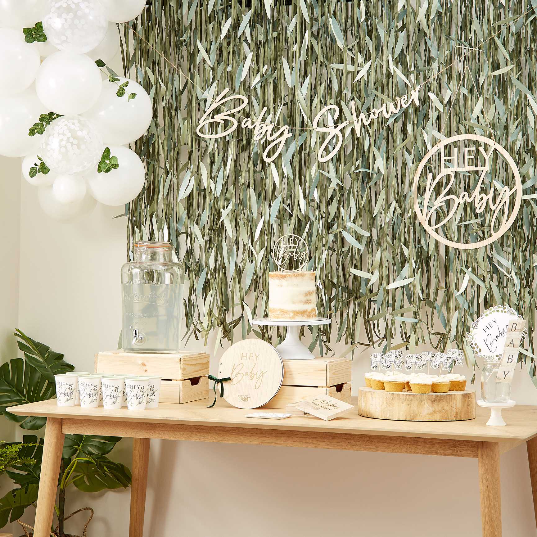 artificial green leaf backdrop for a boho theme botanical party idea decoration