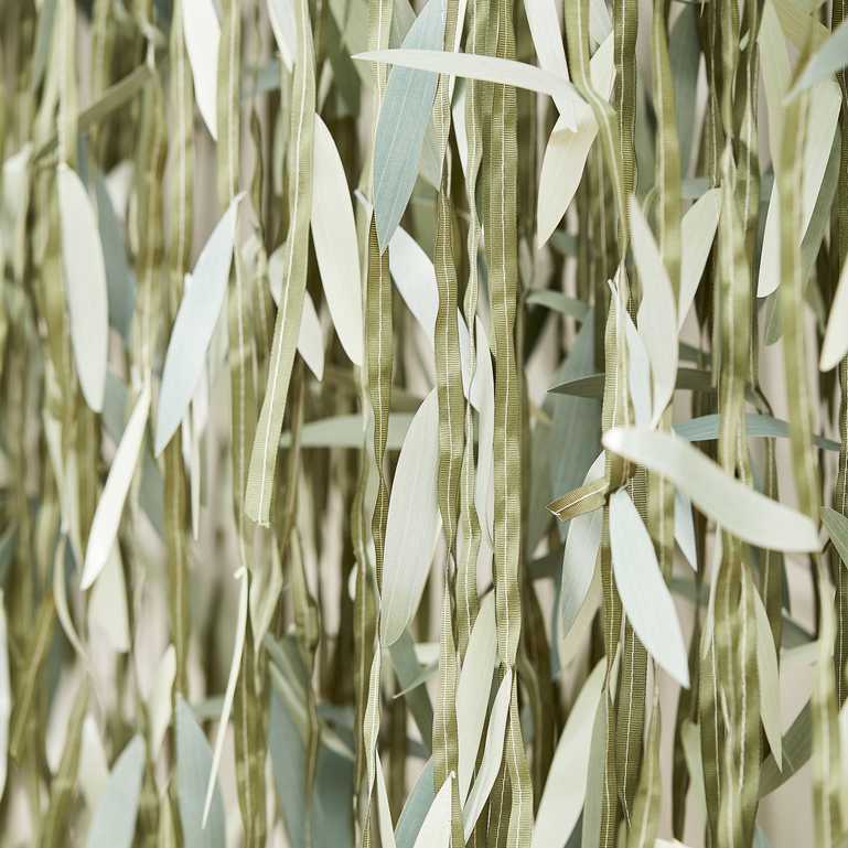 artificial green leaf backdrop for a boho theme botanical party idea decoration