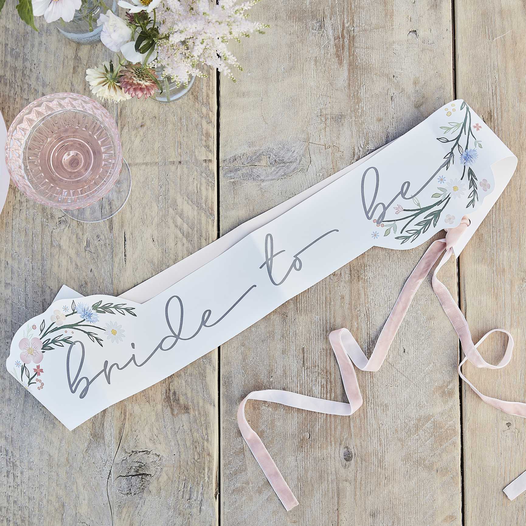 floral flower sash that says 'bride to be' for a boho themed or garden cocktail party bridal shower, hens party or bachelorette party