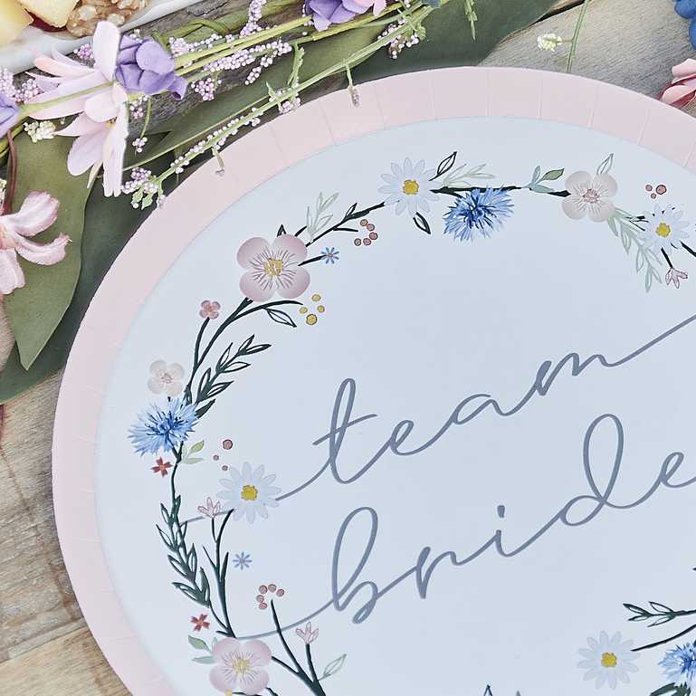 floral flower design paper party plates with the words 'team bride' written on them for a boho or garden party theme bachelorette, bridal shower or hens party