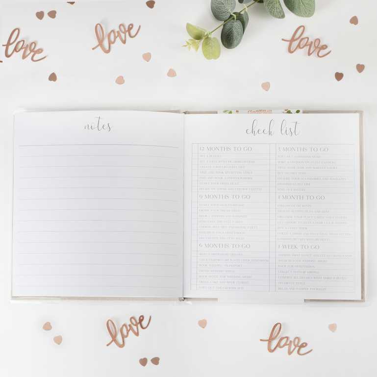 grey suede wedding planner journal book with the words 'wedding planner' printed on the front in rose gold for an engagement party or bridal shower, hens party gift