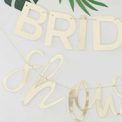 gold bridal shower hanging banner butning with the words 'bridal shower' for a bridal shower gold theme party decoration