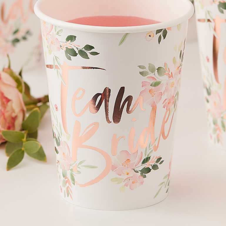 floral flower design paper party cups wiht the words 'team bride' in rose gold printed on them for bridal showers, hens parties or a bachelorette party