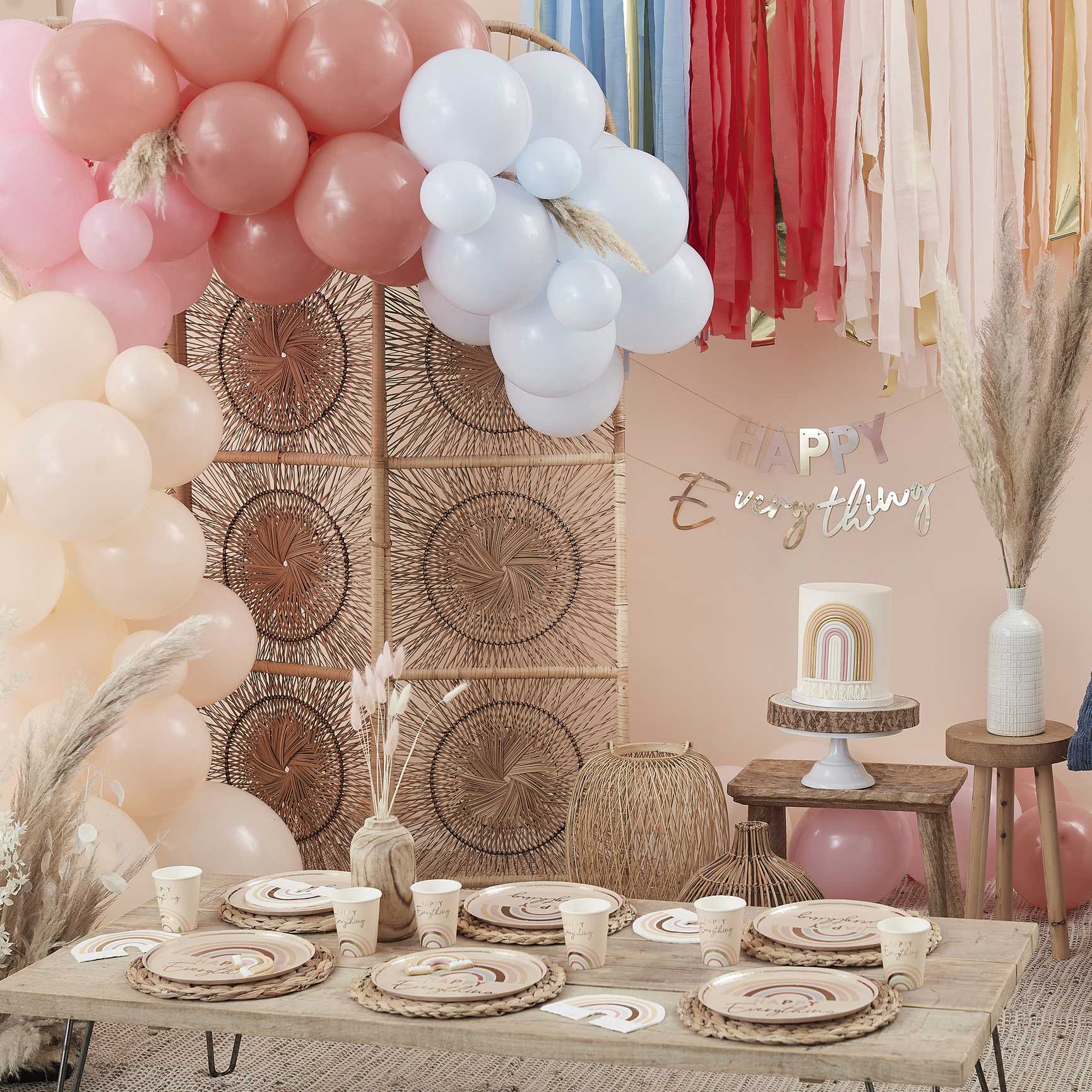 pastel nude coloured hanging banner bunting that says the words 'happy everything' for a birthday party decoration