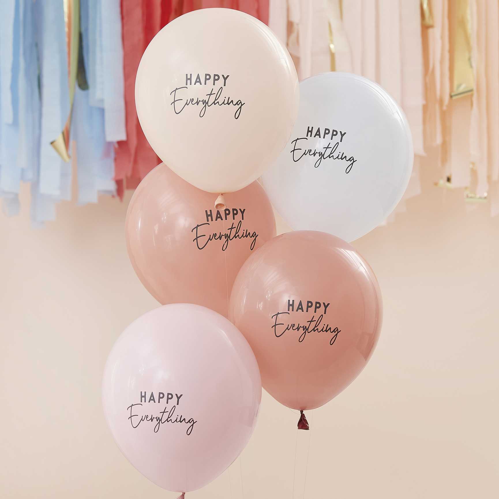 nude cream neautral colour tone balloons with the words 'happy everything' printed on them for a joyful happy birthday party theme decoration