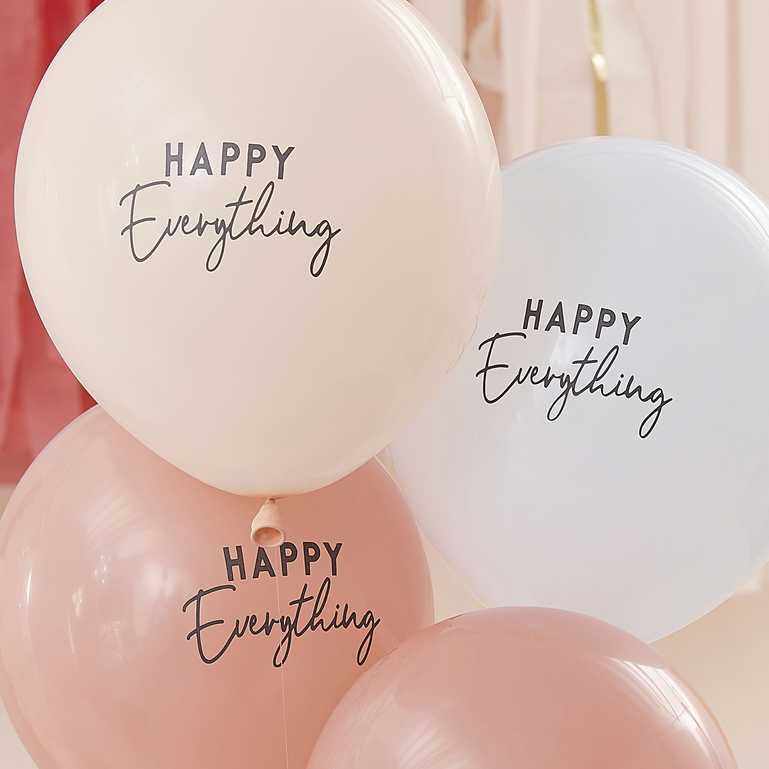 nude cream neautral colour tone balloons with the words 'happy everything' printed on them for a joyful happy birthday party theme decoration