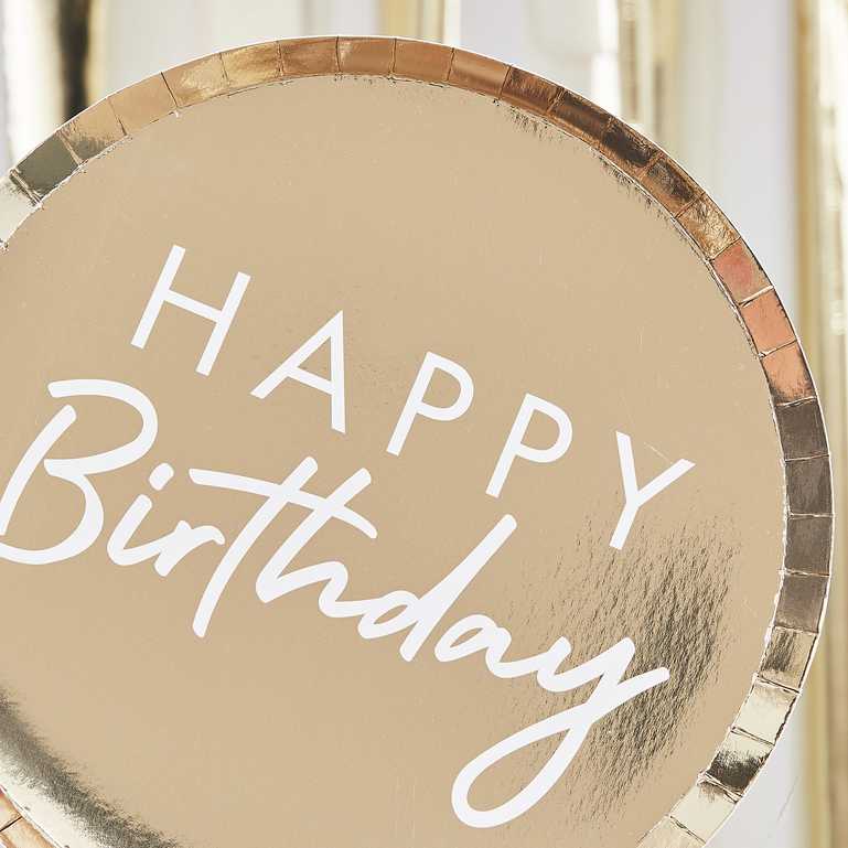 gold paper party plates with the words 'happy birthday' printed on them in white for a gold theme birthday party decoration