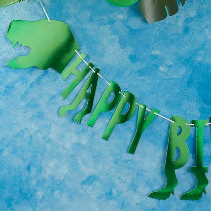 green dinosaur baner bunting with the words 'happy birthday' for a kids dinosaur birthday party theme party decorations