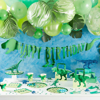 green dinosaur baner bunting with the words 'happy birthday' for a kids dinosaur birthday party theme party decorations