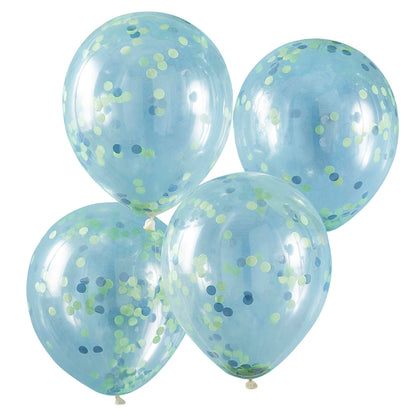 clear balloons with green and blue paper confetti on the inside for a kids dinosaur birthday party theme decorations