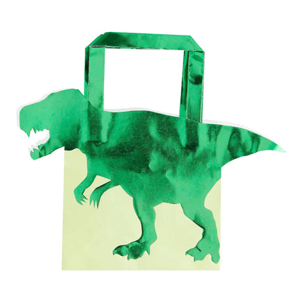 green dinosaur paper party bags with a 3d dinosaur design for a kids dinosaur party theme treat or gift bags