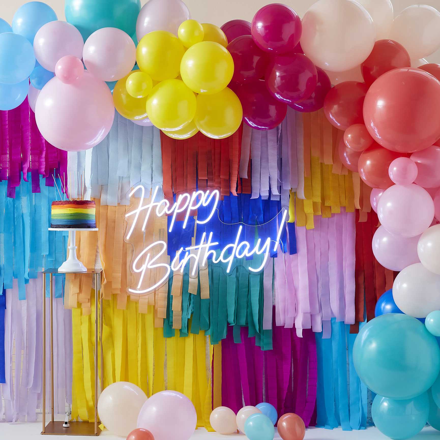 bright colourful rainbow paper streamer party backdrop decoration wall