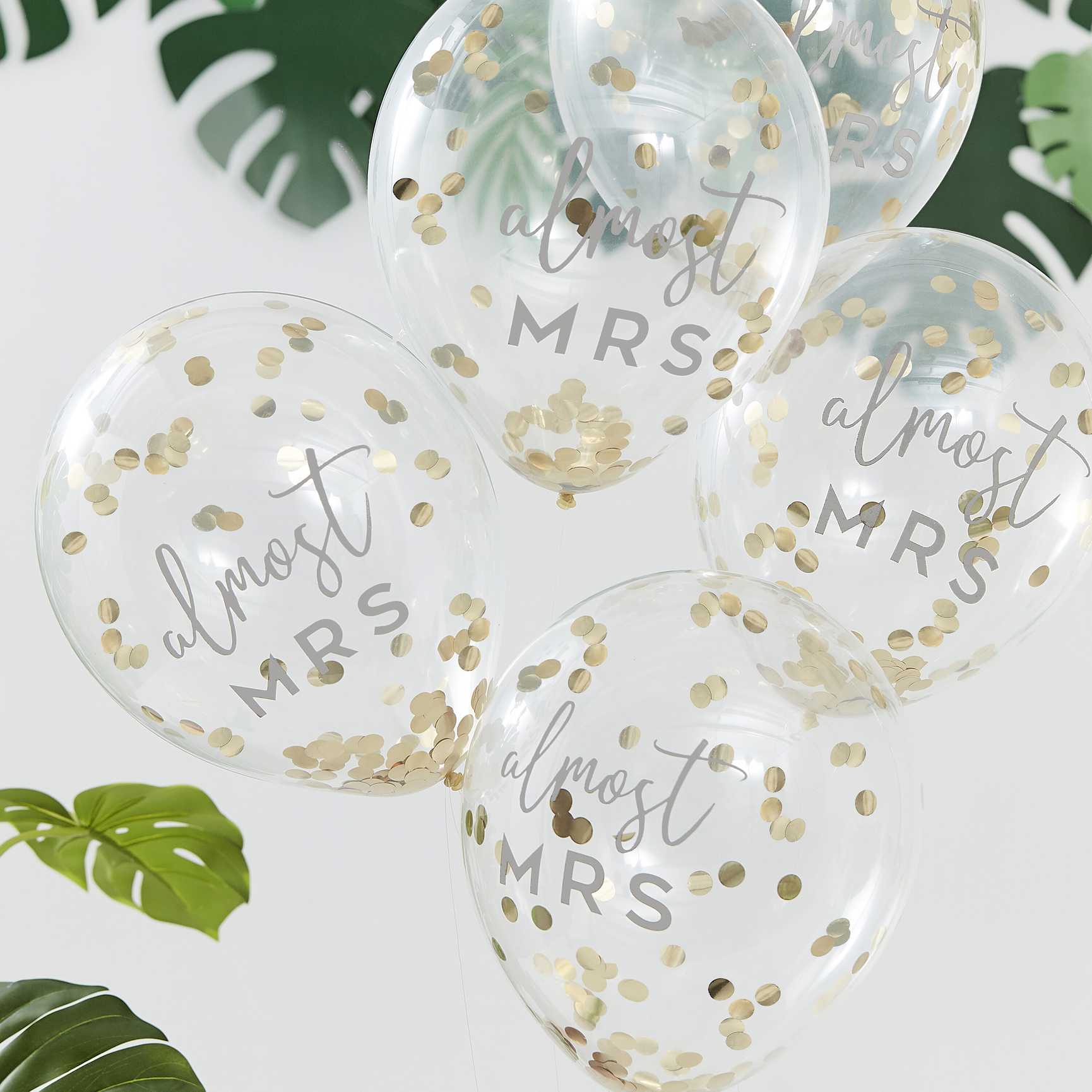 clear balloons fileed with gold confetti with the writing 'almost mrs' written on them for bridal showers, hens party or bachelorette gold theme party decorations