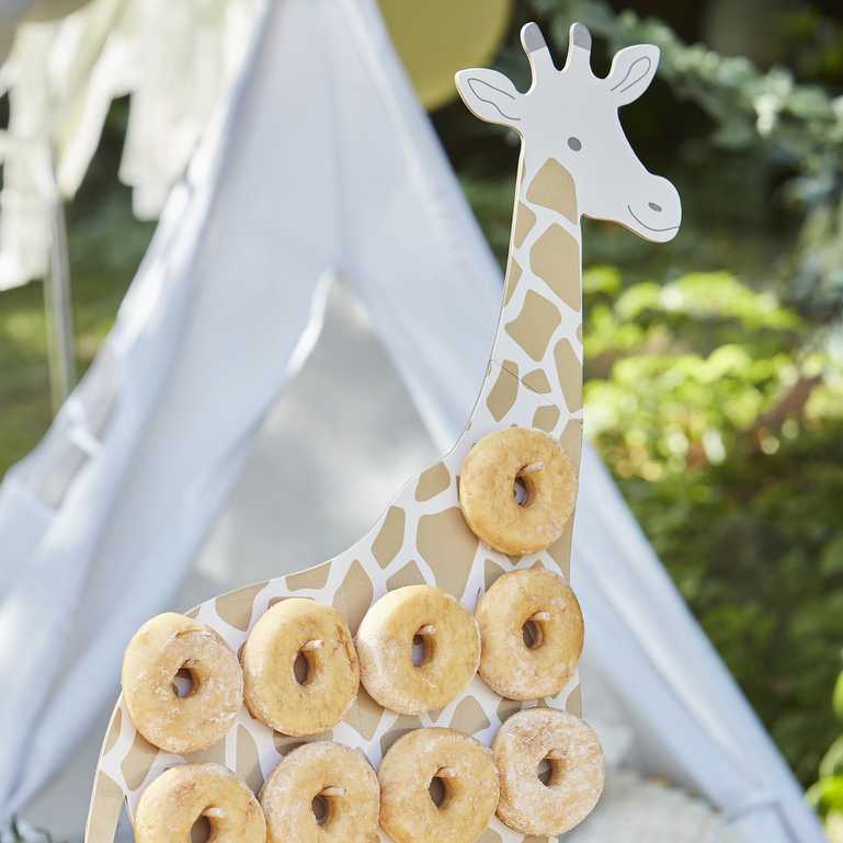 Giraffe shaped doughbnut display stand for a wild animal jungle safari theme birthday party for kids