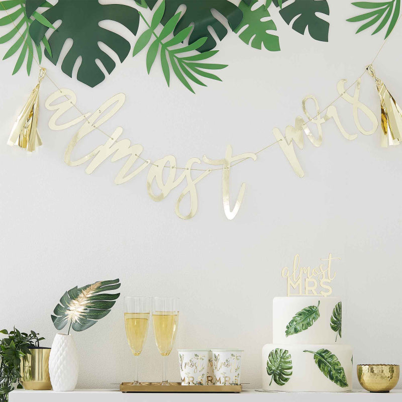 gold hanging banner bunting that says 'almost mrs' for a bridal shower, hens party or bachelorette party decoration