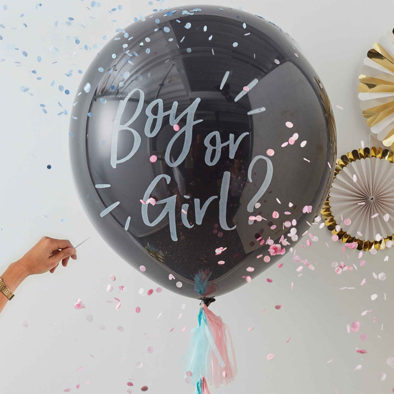 boy or girl gender reveal confetti explosion surprise photo balloon with pink and blue confetti for a boy or girl