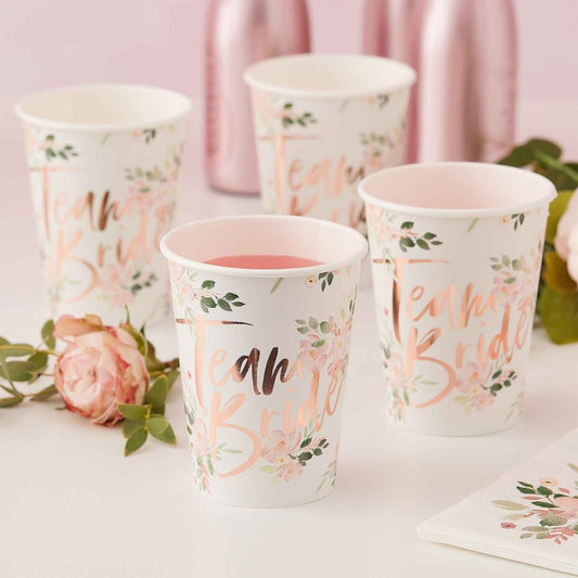 floral flower design paper party cups wiht the words 'team bride' in rose gold printed on them for bridal showers, hens parties or a bachelorette party