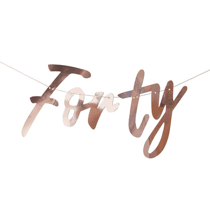 Rose gold wording banner that says 'forty' for a 40th birthday party decoration