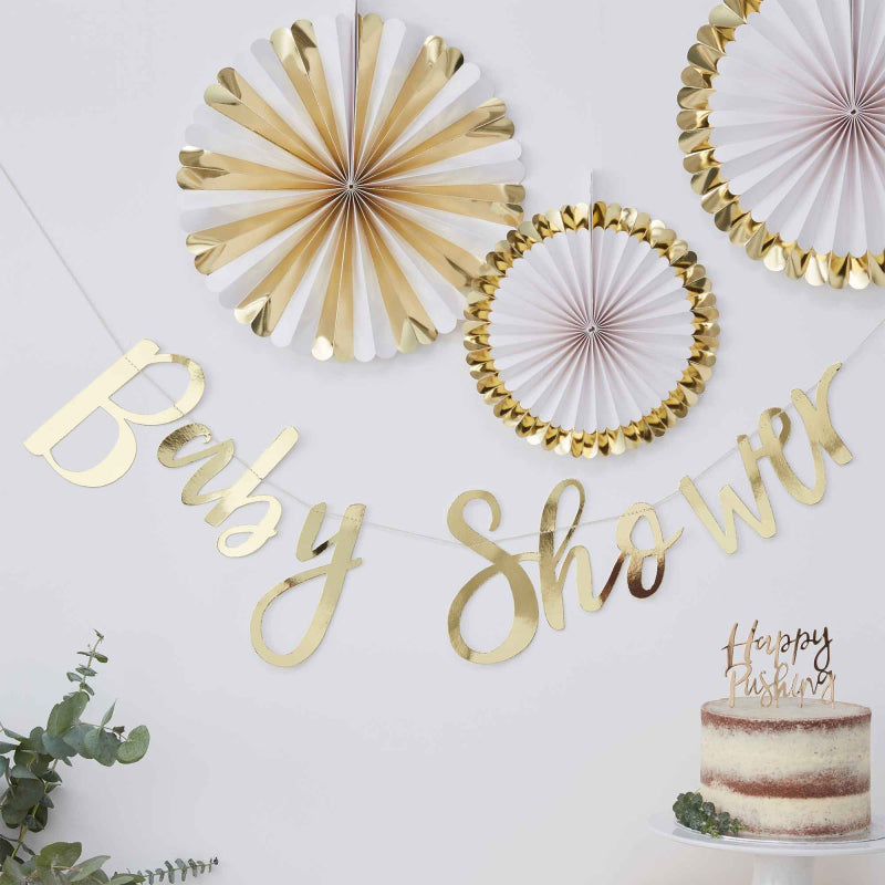 gold hanging banner bunting that says 'baby shower' for a gender reveal or baby shower party decoration theme