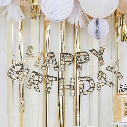 gold fringe happy birthday hanging banner bunting that reads the words 'happy birthday' for a gold theme birthday party decoration