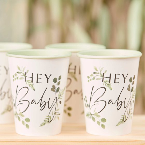 botanical greenery leaf style paper party cups with the words 'hey baby' printed on them for a botanical gender neautral baby shower party theme decoration