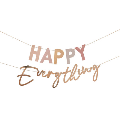 pastel nude coloured hanging banner bunting that says the words 'happy everything' for a birthday party decoration